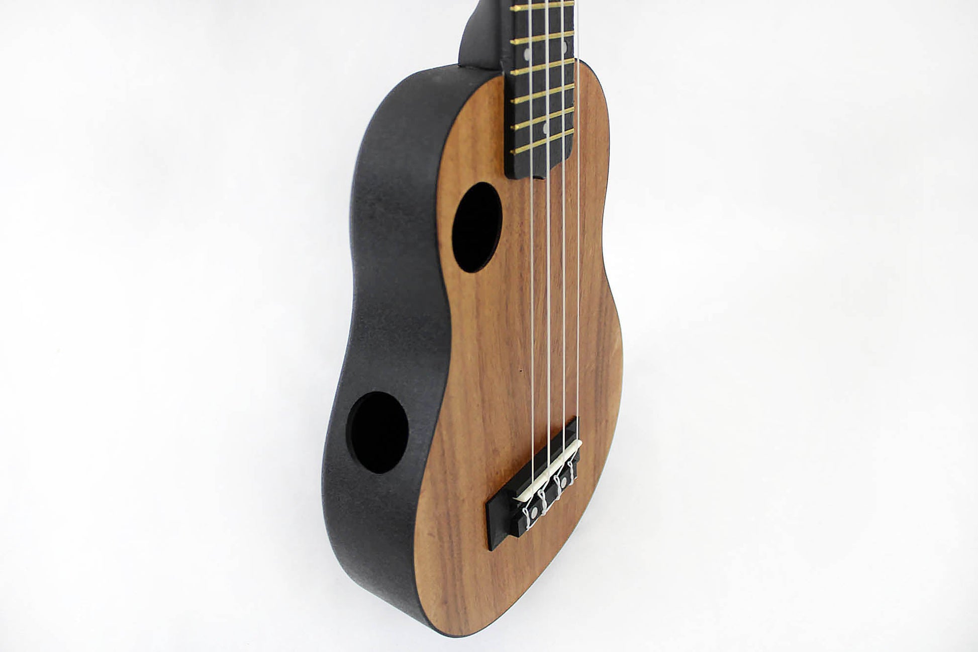 This is the front side view of an Amahi HCLF660 ABS Koa Top Soprano.