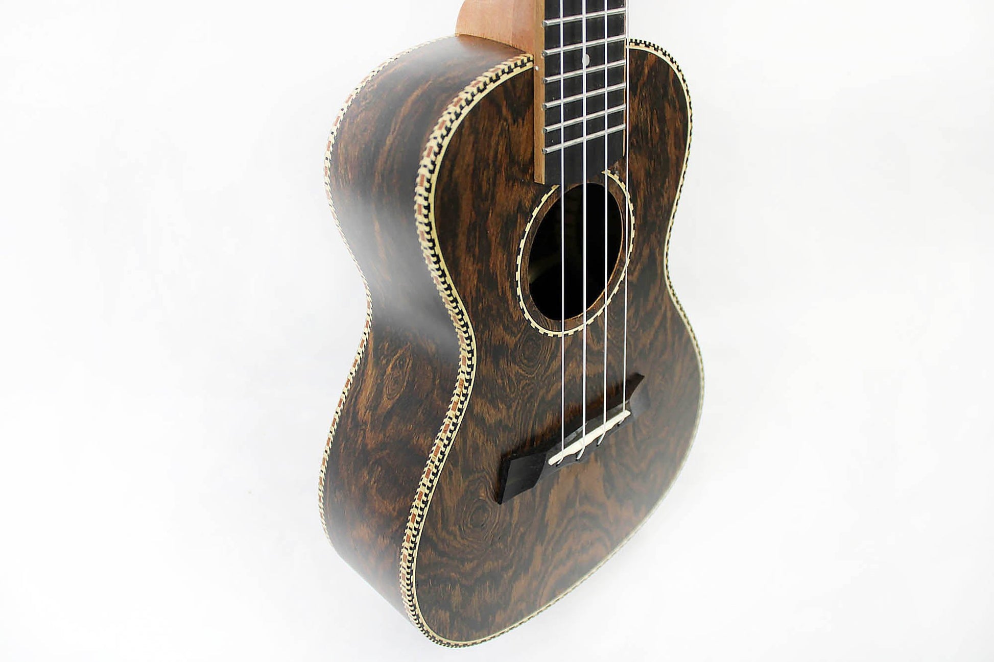 This is the front side view of the top and neck of a Snail SNAILBOCUKC Bocote Concert Ukulele.