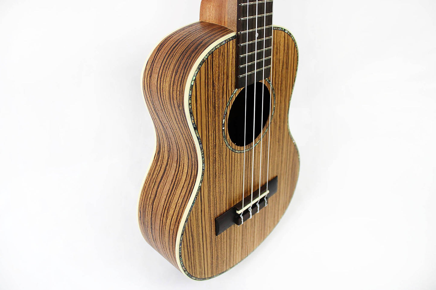 This is the front side view of the top and neck of a Snail SNAILZEBUKT Zebrawood Tenor Ukulele.