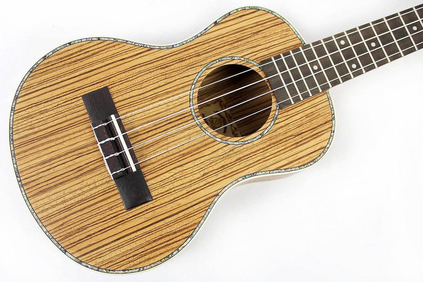 This is the front of the top and neck of a Snail SNAILZEBUKT Zebrawood Tenor Ukulele.